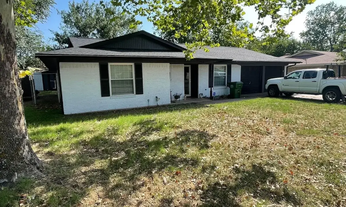 Professional roofing crew working on a residential roof in Mitchell